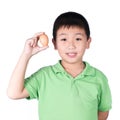 Boy holding hen egg in hand on white background isolated Royalty Free Stock Photo