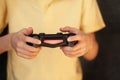 Boy holding joystick and playing video game, Resting At Home