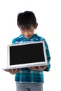 Boy holding laptop against white background Royalty Free Stock Photo