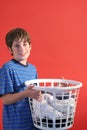 Boy holding laundry