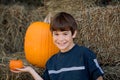 Boy Holding a Little Pumpkin