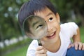 Boy holding magnifier Royalty Free Stock Photo