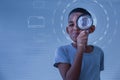 Boy holding the magnifying glass, Little kid boy holding and looking through magnifying glass showing a big eye