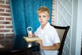 Boy holding a magnifying glass Royalty Free Stock Photo