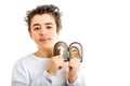 Boy holding Merciful Jesus and Our Lady of Medjugorje icon