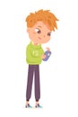 Boy holding mobile phone, funny young male person wearing casual jeans and hoodie