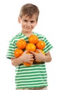 Boy holding oranges