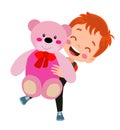 a boy is holding a pink teddy bear Royalty Free Stock Photo