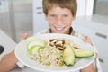 Boy holding plate of food Royalty Free Stock Photo