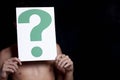 Boy holding a question mark Royalty Free Stock Photo