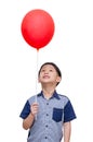 Boy holding red balloon over white background Royalty Free Stock Photo