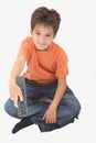 A boy holding a remote Royalty Free Stock Photo