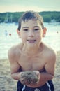 Boy Holding Sand at Beach Royalty Free Stock Photo