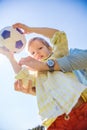 Boy holding soccer ball