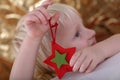 Boy holding star ornament Royalty Free Stock Photo