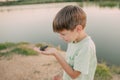The boy is holding a toad Royalty Free Stock Photo