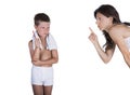 Boy holding toothbrush reprimanded by mother Royalty Free Stock Photo
