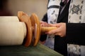 Boy holding Torah scrolls