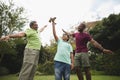 Boy holding toy airplane with father and son at park Royalty Free Stock Photo