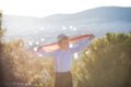 Boy holding Turkey flag against city. Kid hand waving Turkish flag view from back, copy space for text