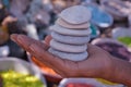 Boy holding white stones pebbles in hand Royalty Free Stock Photo