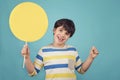 Boy holding a yellow sign Royalty Free Stock Photo