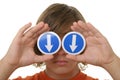 Boy holds before arrow eyes specifying downwards Royalty Free Stock Photo