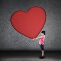 Boy holds big blank heart sign