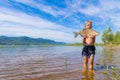 A boy holds a caught bream. Royalty Free Stock Photo