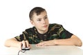 The boy holds a computer mouse in a hand o Royalty Free Stock Photo