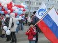 The boy holds the flag of Russia