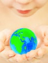 Boy holds globe in hands Royalty Free Stock Photo