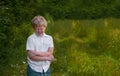 Boy holds his hand and winces at the pain in the Park Royalty Free Stock Photo