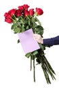 Boy holds a large bouquet of red roses and empty greeting card in his hands. Flowers for mom.