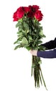 Boy holds a large bouquet of red roses with high stems and green leaves in his hands. Flowers for mum. Mother`s day concept