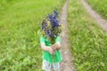 The boy holds out a bouquet Royalty Free Stock Photo