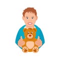 A boy holds a teddy bear.