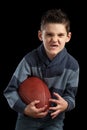 Boy Holidng Football and Making Scary Face Royalty Free Stock Photo