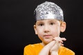 boy with a homemade cap made of aluminum foil