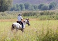 Boy on a horse on nature Royalty Free Stock Photo