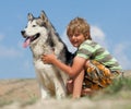 Boy hugging a fluffy dog Royalty Free Stock Photo