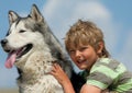 Boy hugging a fluffy dog Royalty Free Stock Photo