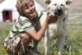 Boy hugging a fluffy dog Royalty Free Stock Photo