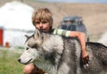 Boy hugging a fluffy dog Royalty Free Stock Photo