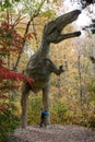 Boy hugging a Full size dinosaur Royalty Free Stock Photo