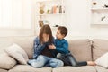 Boy hugging his crying sister at home Royalty Free Stock Photo