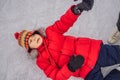 Boy ice skating fell down on the ice rink Royalty Free Stock Photo