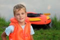 Boy and inflatable boat ashore