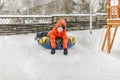 Boy with the inflatable sledge, snow tube