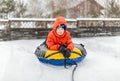 Boy with the inflatable sledge